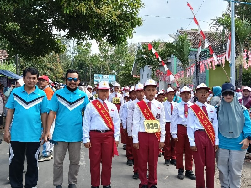 Lomba Gerak Jalan Meriahkan HUT Kemerdekaan RI Ke-80 di Kec. Arjasa Kab. Situbondo